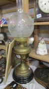 A Victorian brass oil lamp with acid etched shade, COLLECT ONLY.