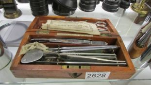 A cased set of assorted instruments/tools.