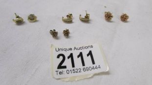 Four pairs of 9ct gold earrings, 5.3 grams.