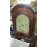 A mahogany inlaid 8 day bracket clock in working order.