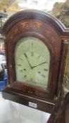 A mahogany inlaid 8 day bracket clock in working order.