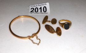 A child's gold bangle, a pair of 9ct gold cuff links and a gold ring, 9.3 grams.