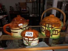 A Burlington ware cottage teapot, biscuit barrel & sugar pot