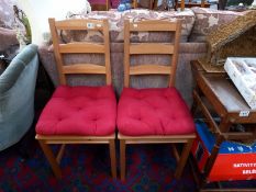 A pair of pine ladder back chairs. COLLECT ONLY.