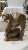 A good quality carved wood Chinese dragon.