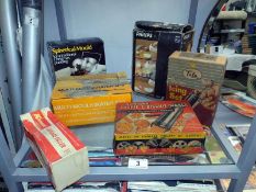 A quantity of vintage boxed kitchen items including Kenwood sausage filler etc