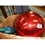 A large Christmas bauble, three long blue glass baubles etc.,