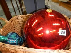 A large Christmas bauble, three long blue glass baubles etc.,