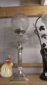 A silver plate Corinthian column oil lamp, COLLECT ONLY.