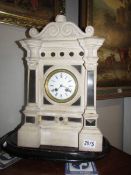 A heavy mantel clock, movement good, porcelain dial has cracks, in working order. COLLECT ONLY.