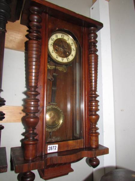 A mahogany Vienna wall clock in working order, COLLECT ONLY. Missing top,