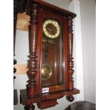 A mahogany Vienna wall clock in working order, COLLECT ONLY. Missing top,