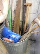 A dustbin containing 10 garden tools and 2 saws. COLLECT ONLY.