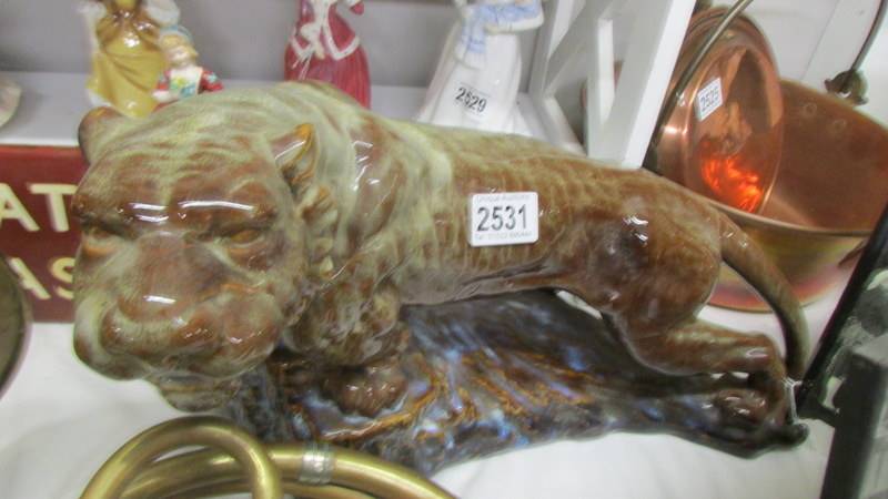 A ceramic figure of a tiger. COLLECT ONLY.