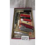 A mixed lot of pen knives and propelling pencils etc.