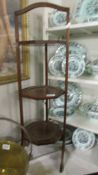 A three tier mahogany inlaid cake stand, COLLECT ONLY.