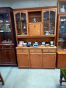 A teak wall unit, 124cm wide, 42cm deep and 190 cm tall, COLLECT ONLY.