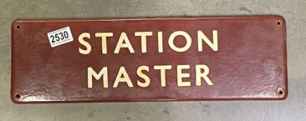 A Station Master metal sign.