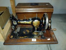 A boxed Jones sewing machine