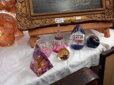 Six old glass paperweights.