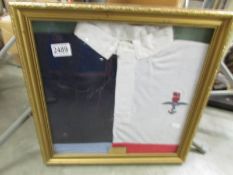 A framed rugby shirt presented by S (Coop) Cooper, 1st April 1995 from RAF Waddington Rugby club,