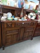 A 1950's oak buffet cupboard. 124cm x 48cm x 123cm. COLLECT ONLY.