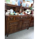 A 1950's oak buffet cupboard. 124cm x 48cm x 123cm. COLLECT ONLY.