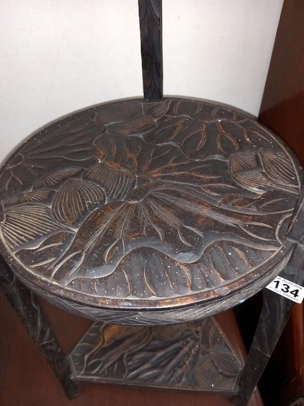 A carved black oak oriental 3 tier stand COLLECT ONLY. - Image 3 of 4
