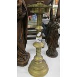 A tall brass candlestick, 40cm.
