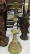 A tall brass candlestick, 40cm.