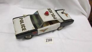 A large 1960's tin plate 'TN' Nomura Japanese battery operated police car.