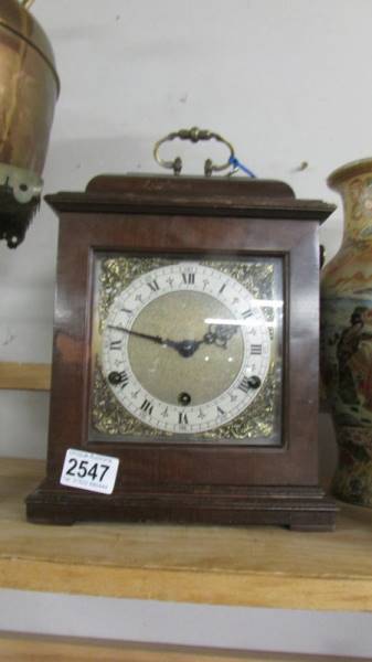 A mahogany bracket clock, in working order.