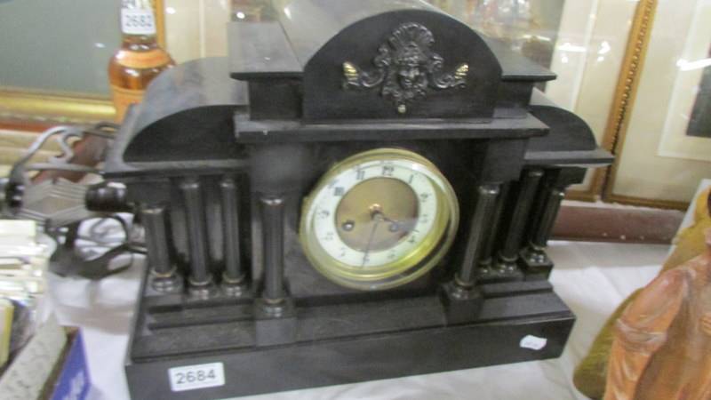 A 19th century black Palidian-style mantel clock, COLLECT ONLY.