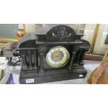 A 19th century black Palidian-style mantel clock, COLLECT ONLY.