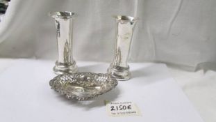 A pair of silver vases and a small silver dish.