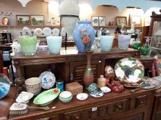 A selection of decorative items for the home including glass vases, porcelain plates, metal vase,