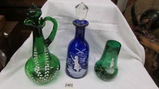 A blue glass Mary Gregory style decanters, a Green vase and an a/f green decanter.