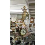 A French marble and ormulu 8 day mantle clock surmounted female figure, in working order.