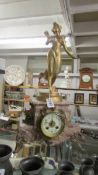 A French marble and ormulu 8 day mantle clock surmounted female figure, in working order.