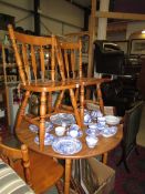 A circular pine kitchen table with three chairs. COLLECT ONLY.