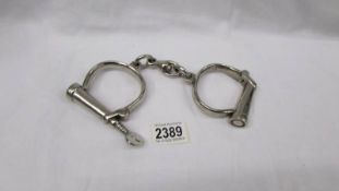 A pair of SMC hand cuffs.