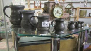 A set of seven Victorian graduated pewter tankards/measures.