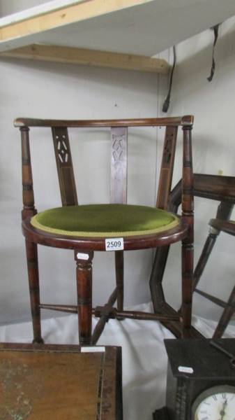 An Edwardian mahogany inlaid corner chair. COLLECT ONLY.