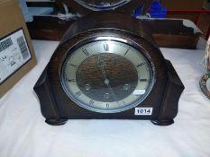 A 1930's oak mantle clock