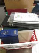 A crate of commemorative and first day covers including Royal Mail album of Millenium stamps