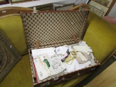 A large vintage suitcase of vintage linens, knitting, sewing, needlecraft patterns, handkerchiefs,
