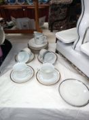 A gilt edged white china tea set with milk jug (setting for 6)