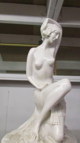 A marble effect semi nude figure on a two tier oxagonal base. - Image 2 of 2