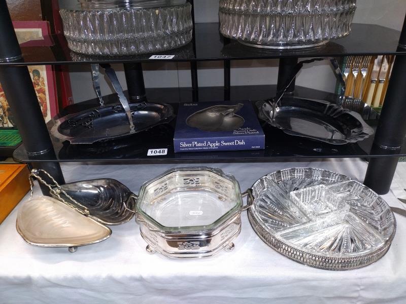 A quantity of silver plated serving dishes, some with glass liners