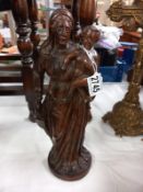 A antique carved wood figure of the Madonna and child. 35cm.